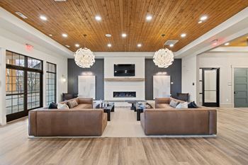 a large living room with couches and a fireplace at Hadley Place Apartments, Pennsylvania, 17025